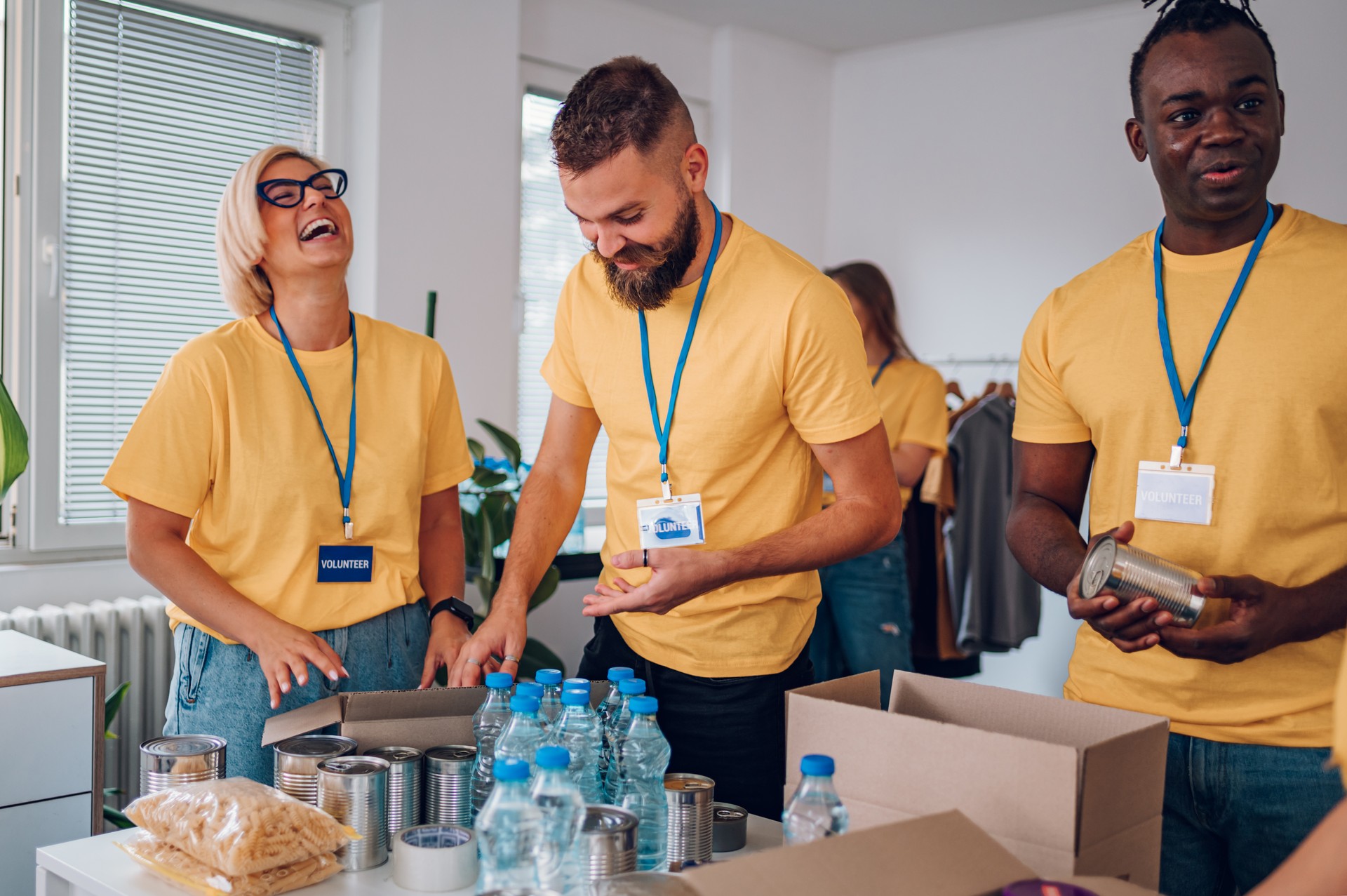 Group of multiracial volunteers working in community charity donation center